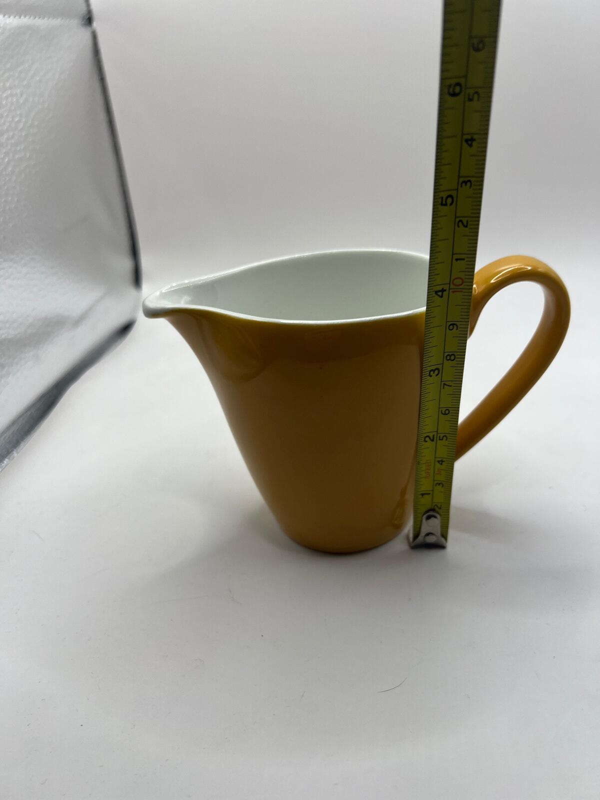 Vintage mustard yellow milk jug creamer. Stamped Johnson Bros England.