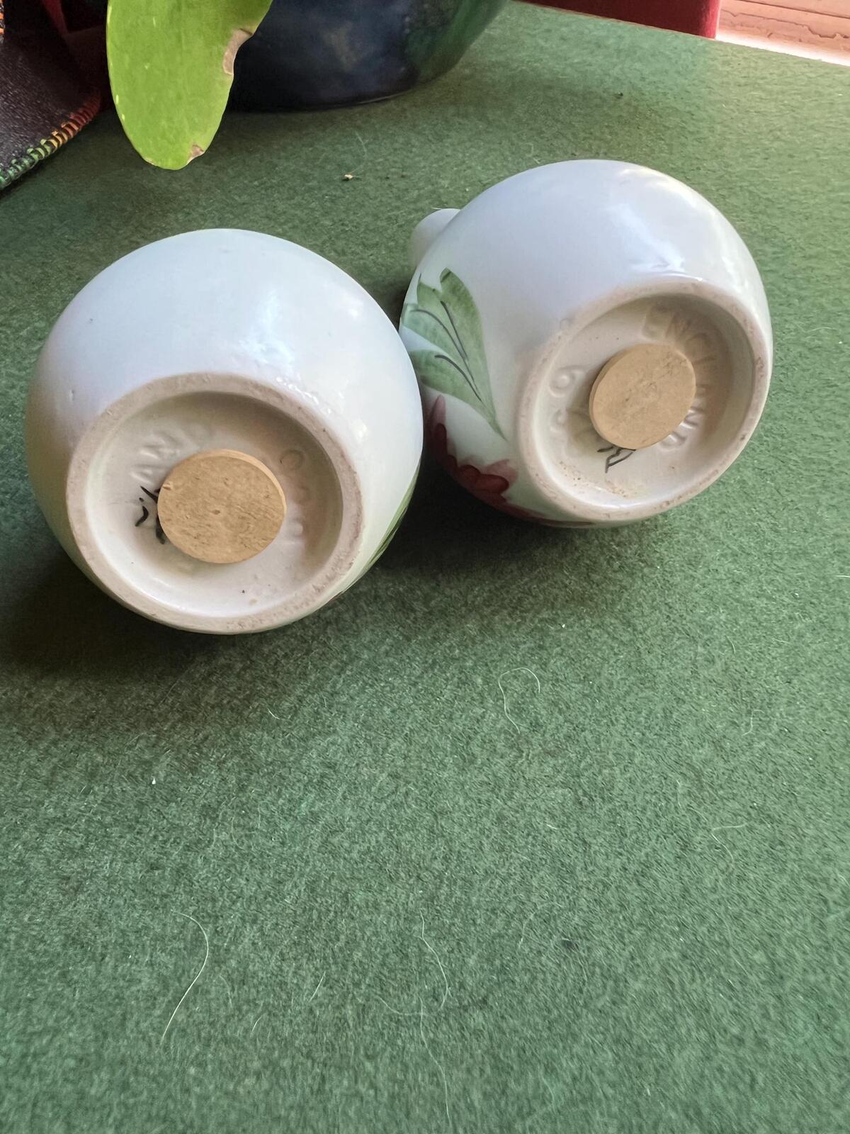 Ceramic salt and pepper shakers. Hand painted red and yellow flowers. Radford.