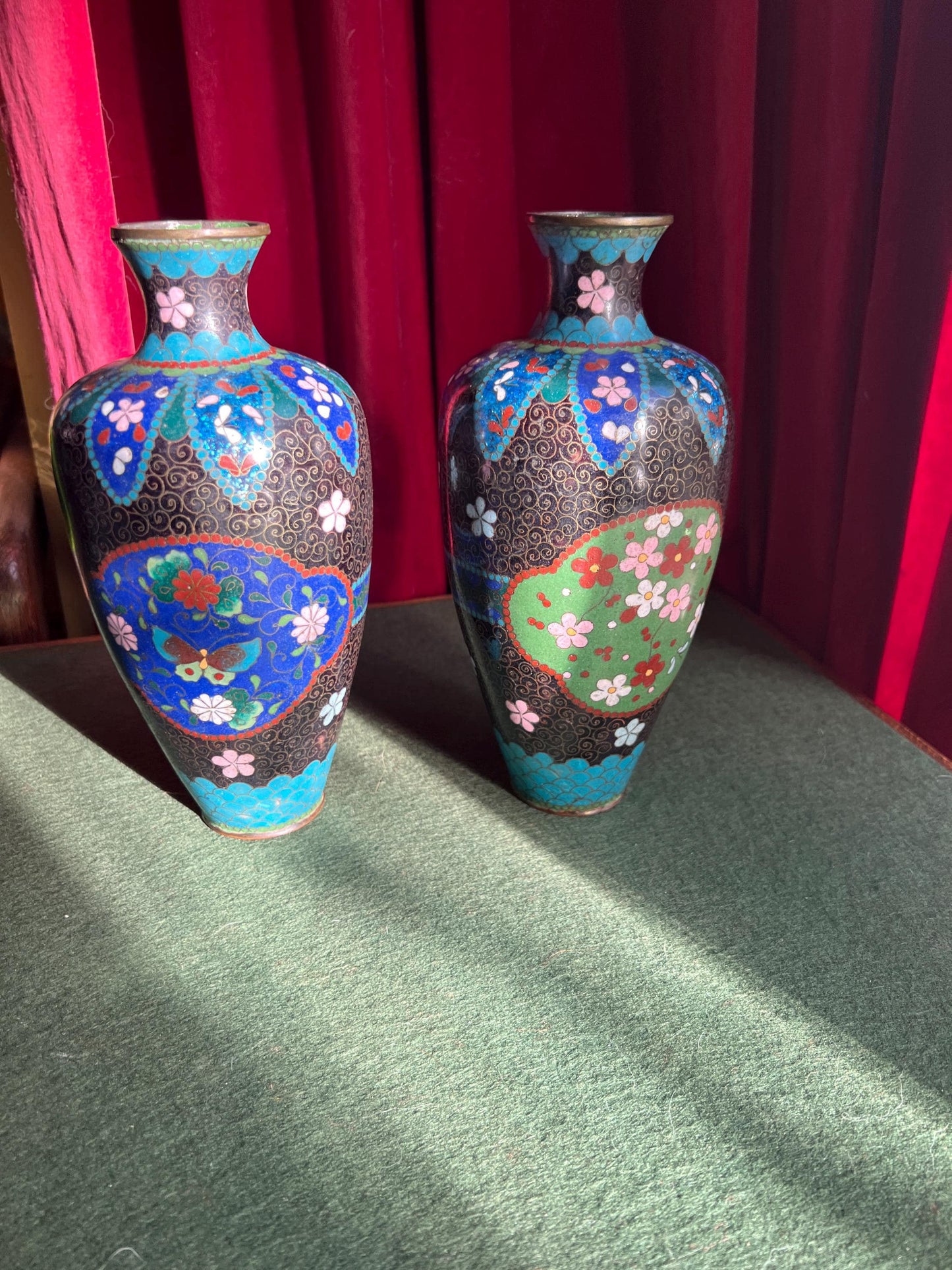 Pair of vintage antique cloisonne vases. Matching pair with intricate flowers and butterflies.