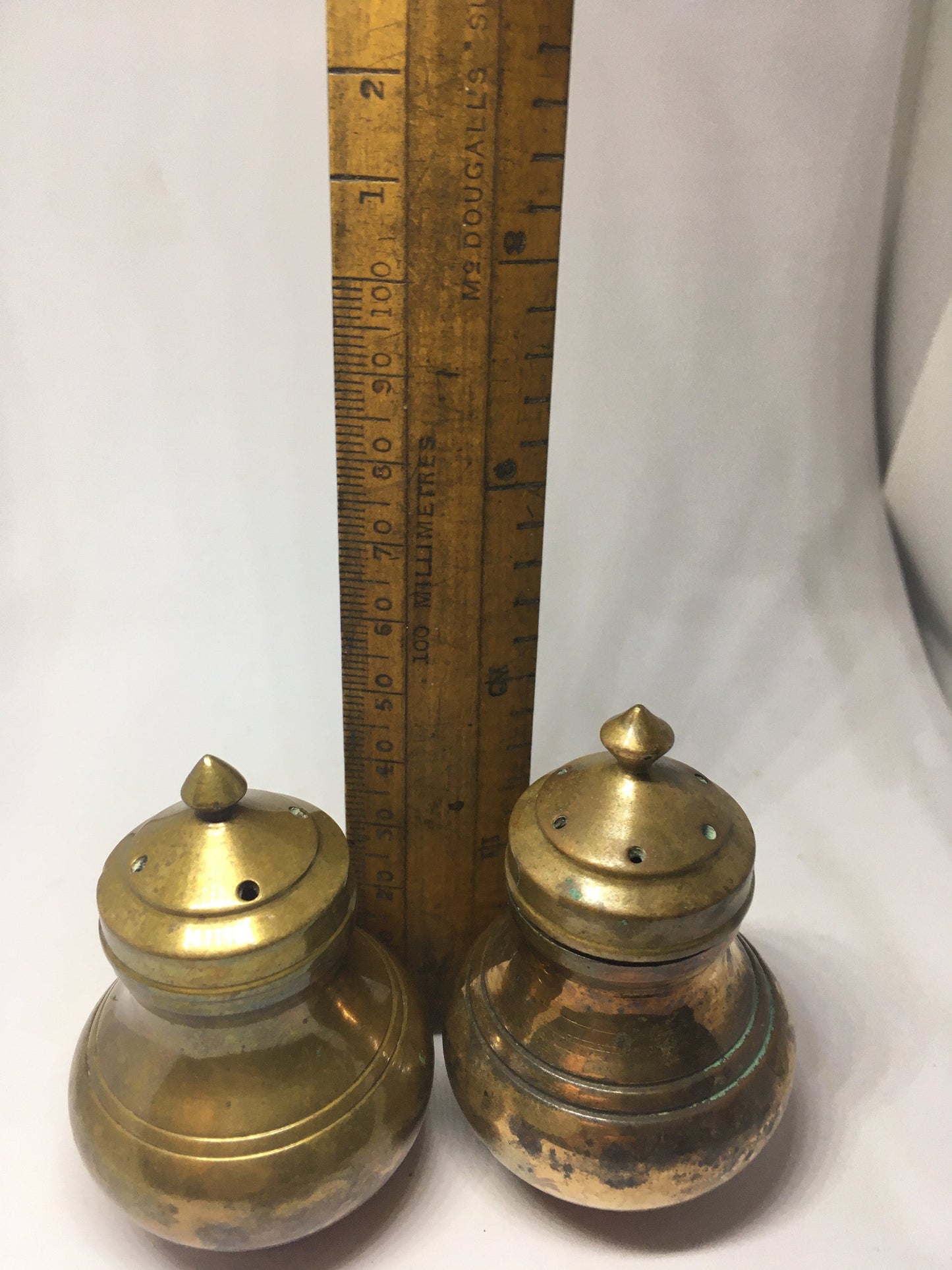 Unusual brass salt and pepper shakers. Screw off lids plastic inserts. Some oxidation.