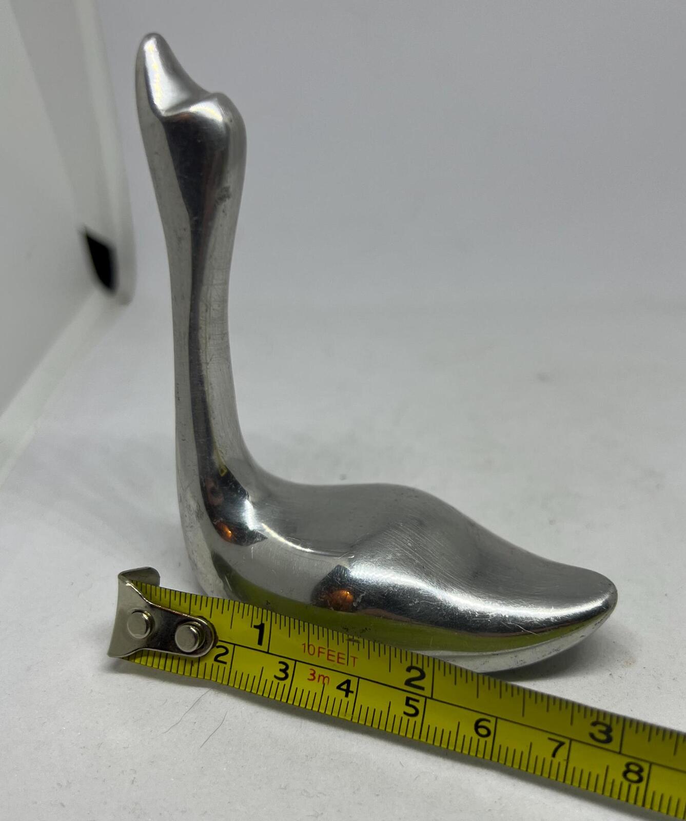 Silver tone swan figurine ring holder.  Signed to base Indistinct Canada 981.