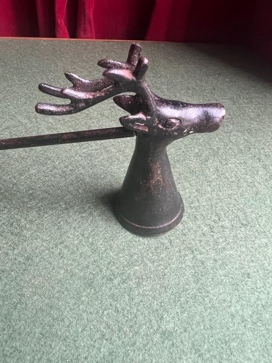 Vintage stag head candle snuffer. Black metal long handled candle extinguisher.