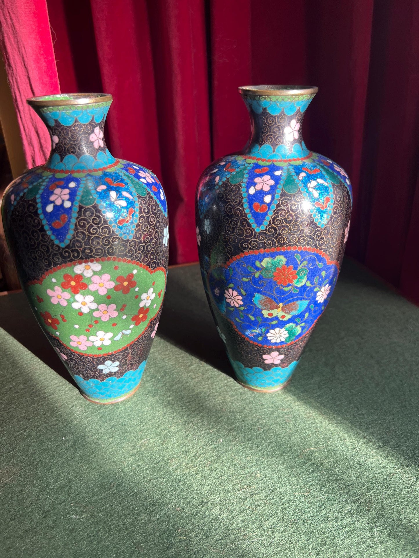 Pair of vintage antique cloisonne vases. Matching pair with intricate flowers and butterflies.