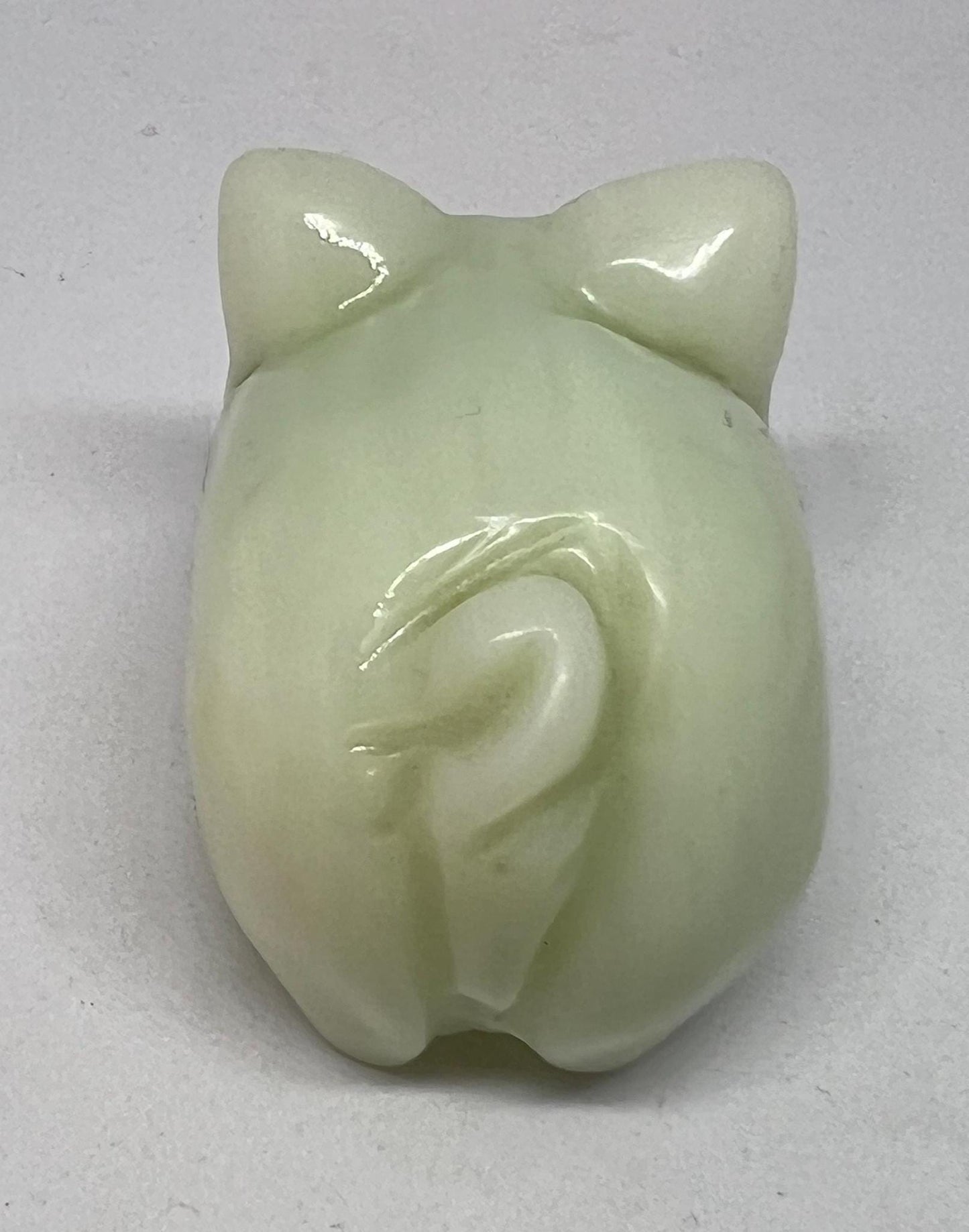 Vintage jade pig figurine. Cute carved white stone jade piglet ornament.