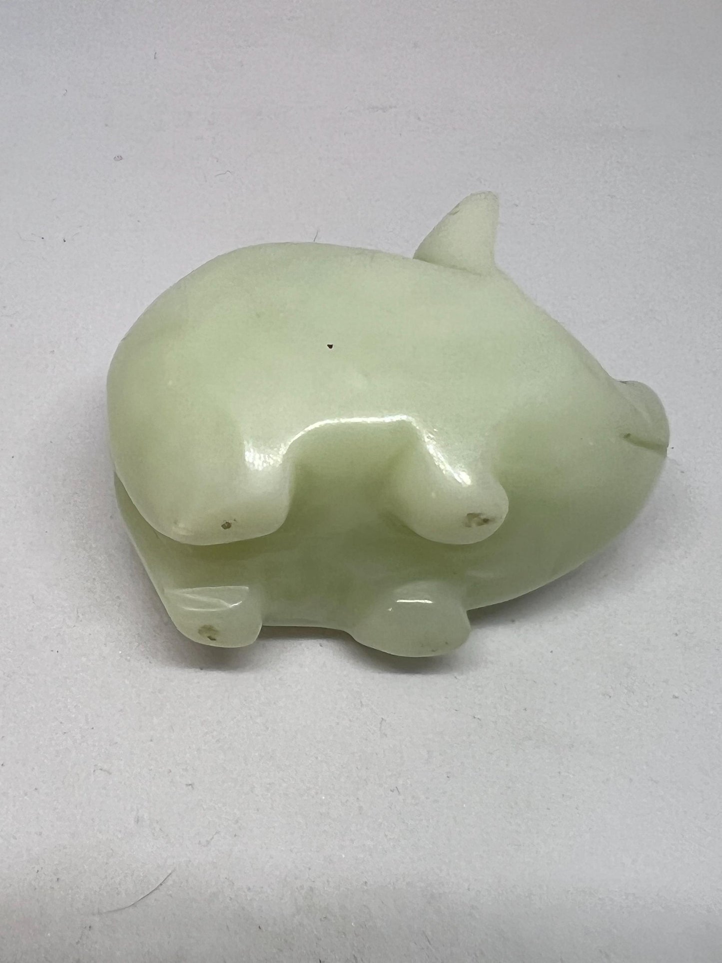 Vintage jade pig figurine. Cute carved white stone jade piglet ornament.