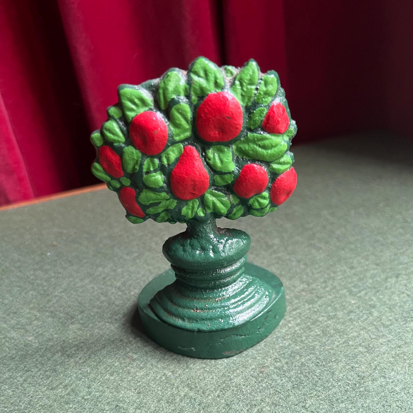 Vintage cast iron door stop. Hand painted red green Apple tree door wedge.