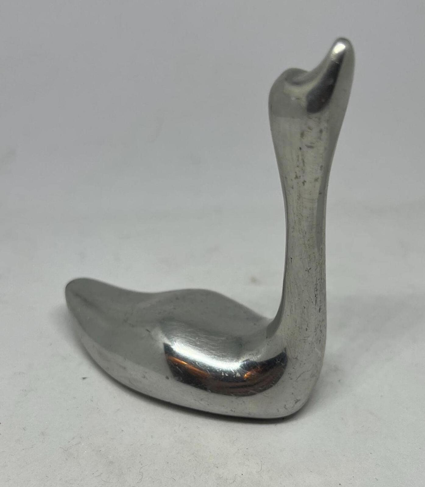 Silver tone swan figurine ring holder.  Signed to base Indistinct Canada 981.
