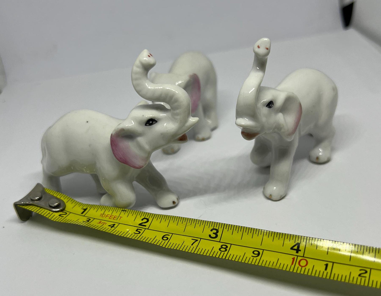 Ceramic elephant family. Lucky trunks raised mum dad and baby elephant collection.