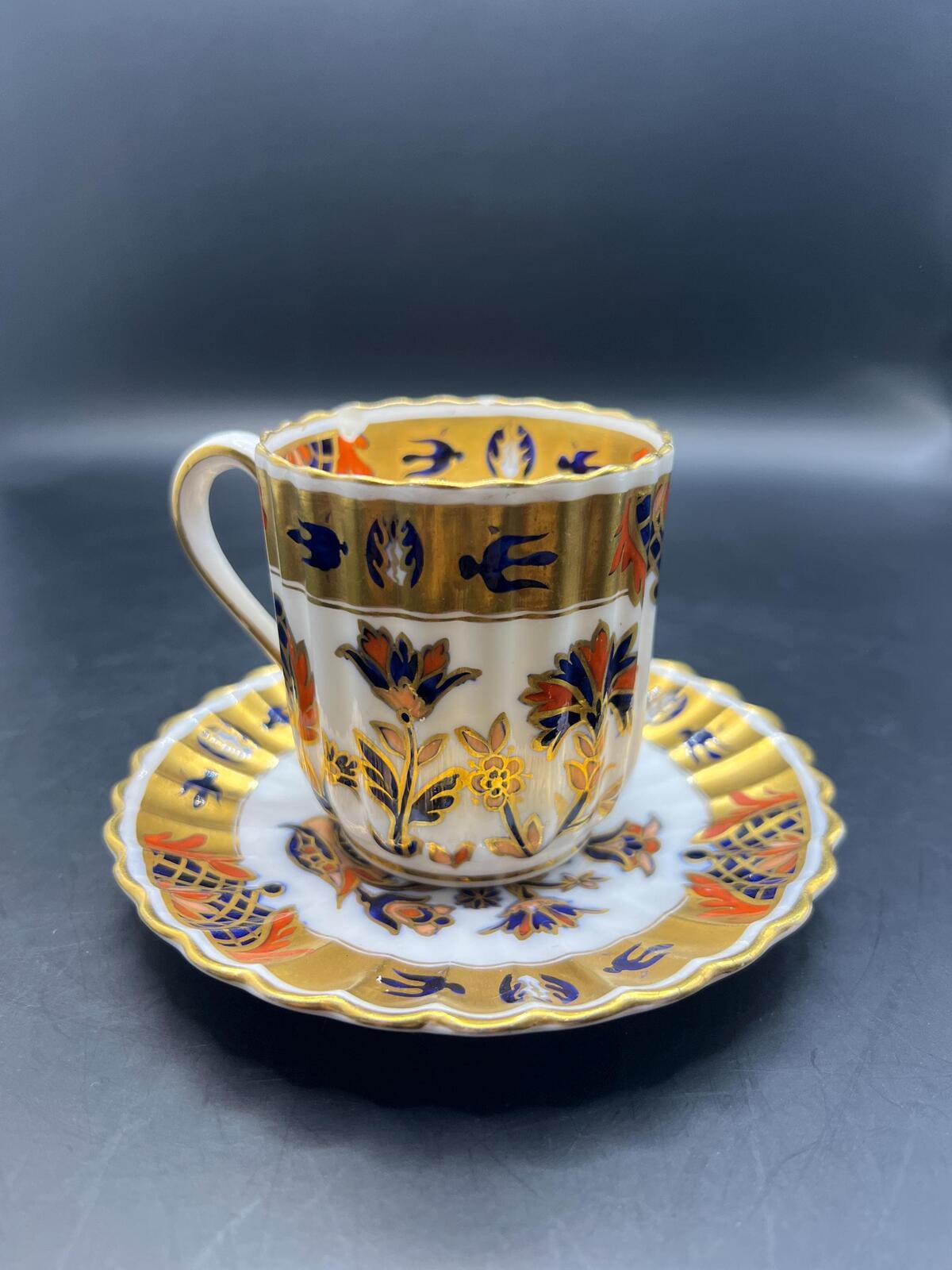Antique coffee can / tea cup and saucer. Vibrant Imari pattern with gold gilt. Stamped Copeland 5.257. AS IS