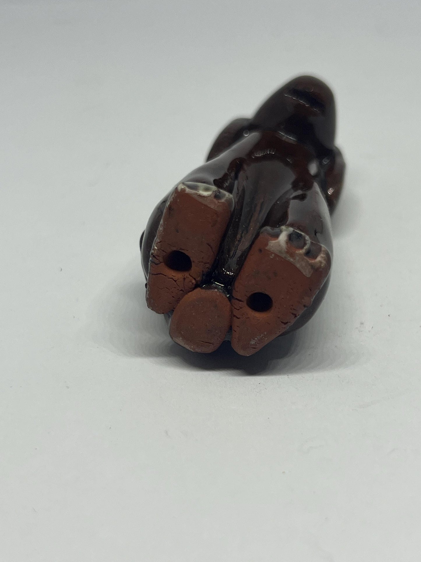 Tiny studio pottery dog figurine.