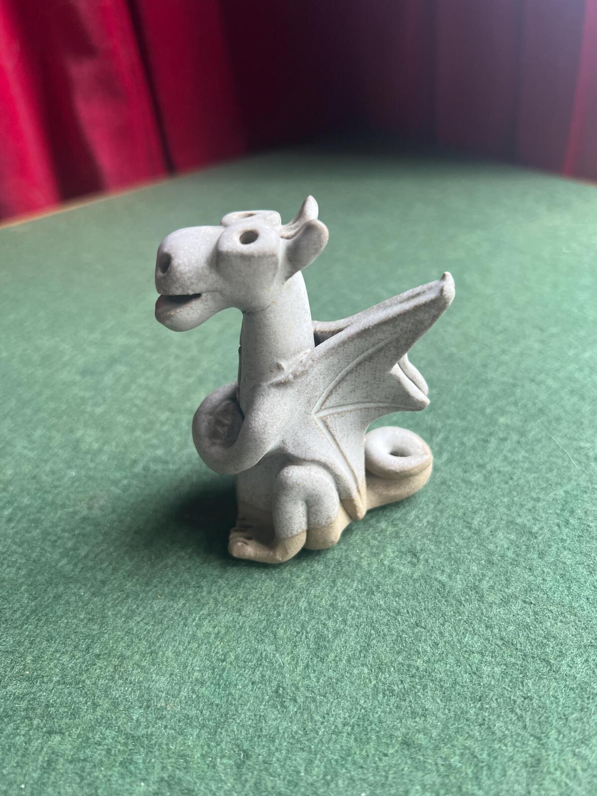 Hand built pottery dragon figurine. Grey clay ready to be painted dragon.