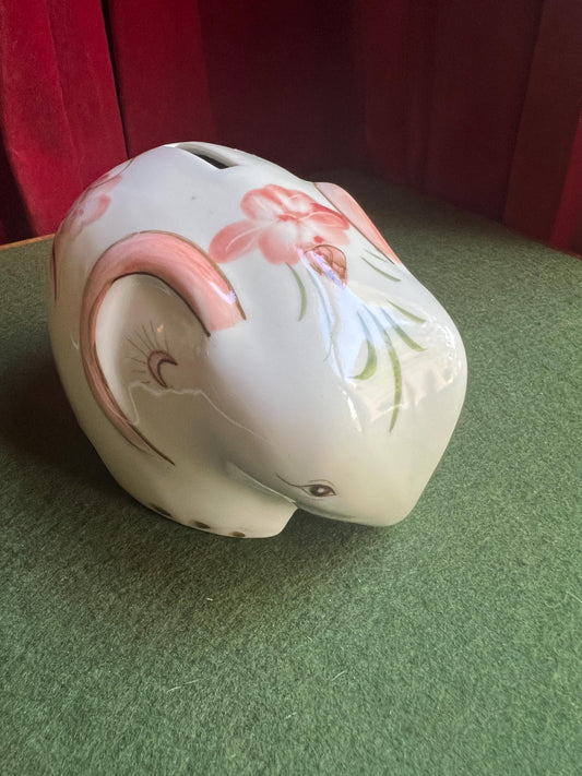 Ceramic elephant money box. Hand painted pink floral design. Made in Thailand.