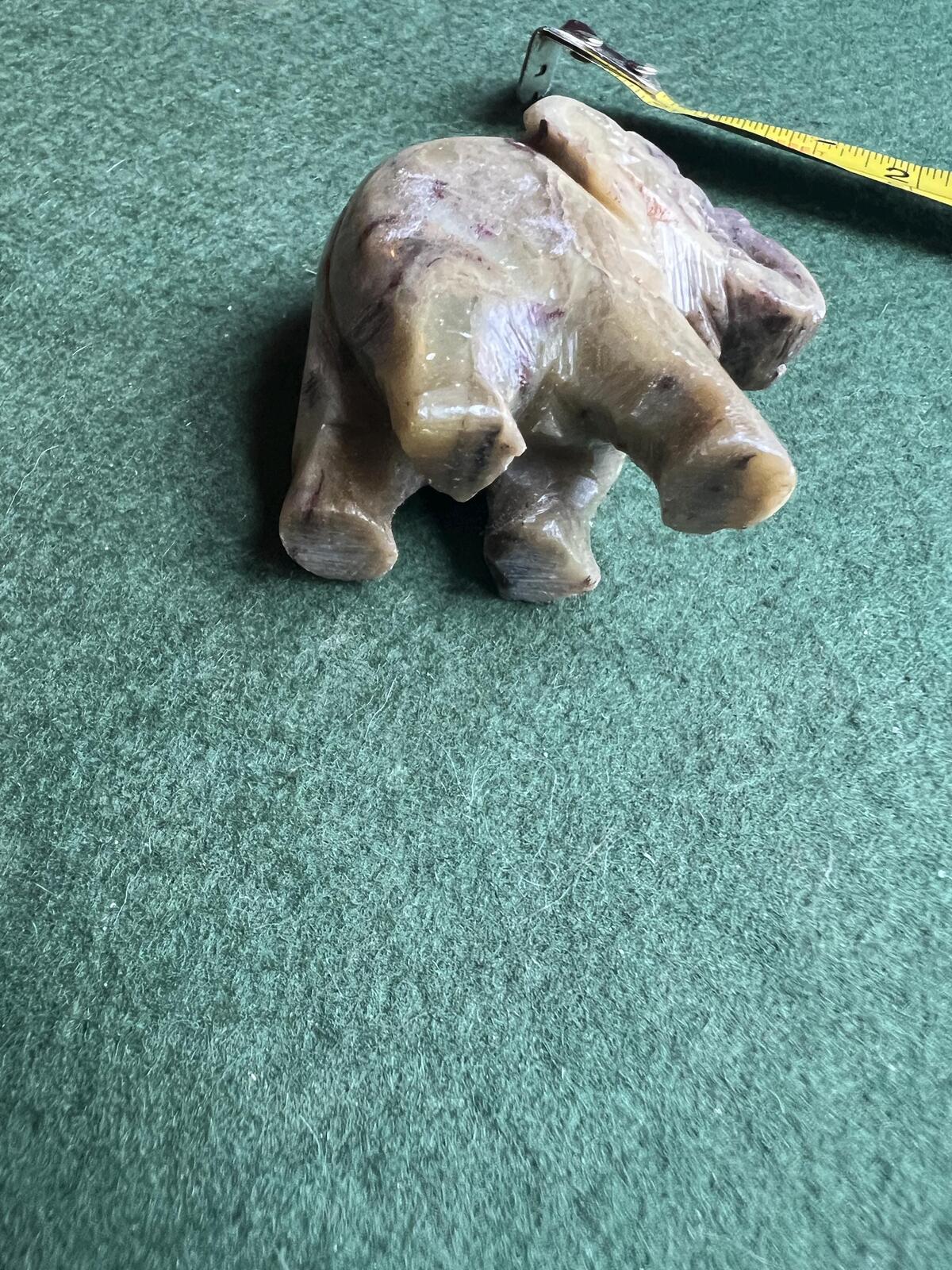 Stone elephant figure. Miniature marble hand carved lucky elephant.