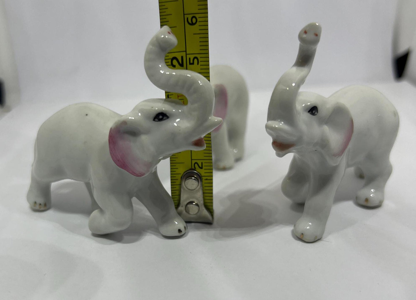 Ceramic elephant family. Lucky trunks raised mum dad and baby elephant collection.