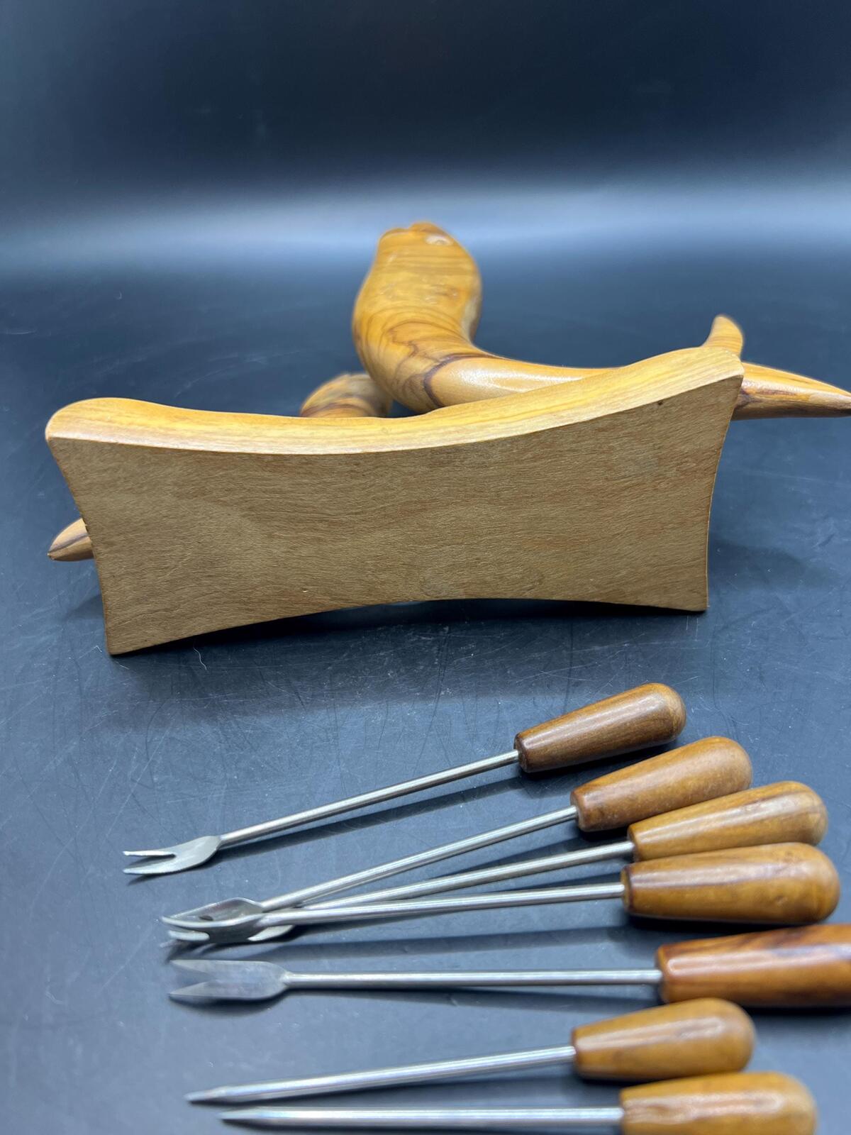 Wooden olive serving set. MCM carved olive wood fish design with 6 forks and 4 picks.
