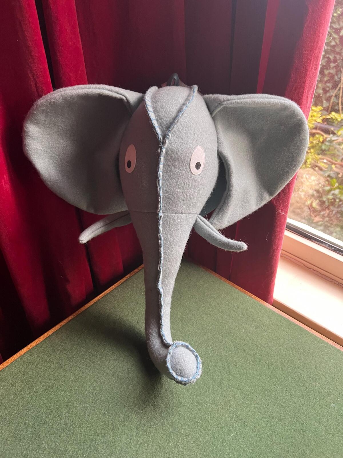 Felted elephant head wall decor for jungle nursery theme. Child's bedroom animal textile wall art.