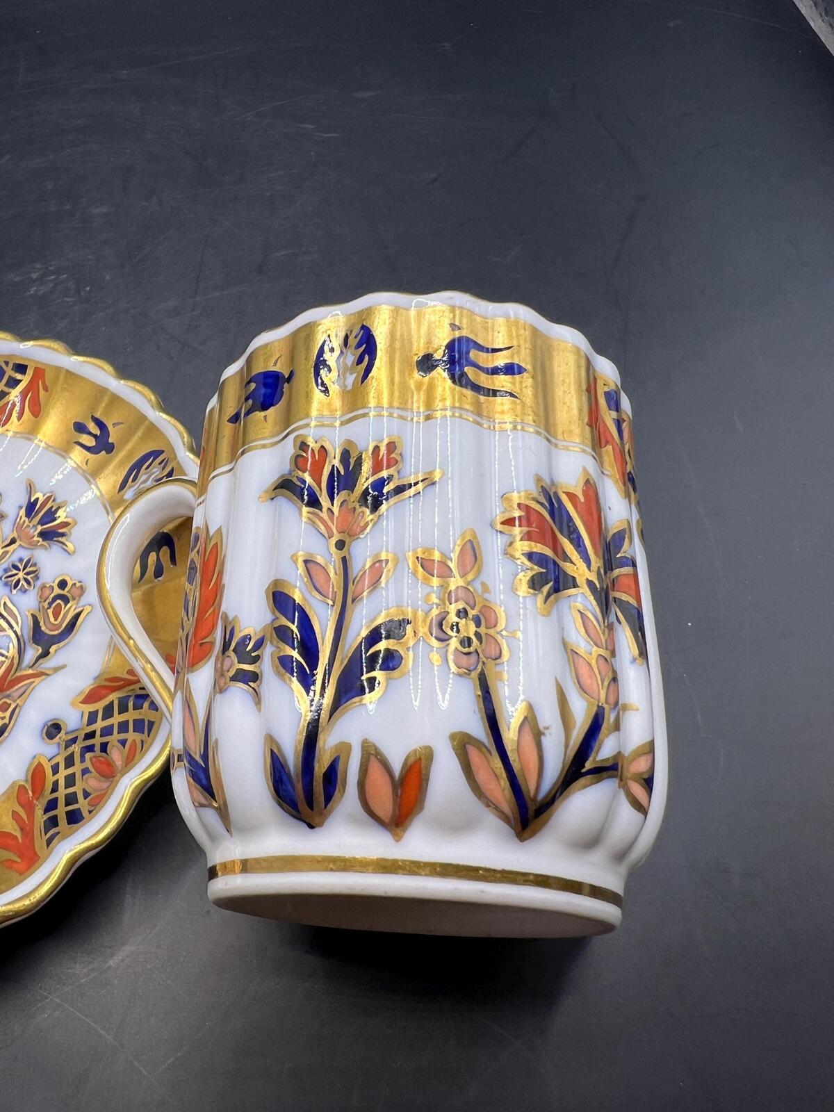 Antique coffee can / tea cup and saucer. Vibrant Imari pattern with gold gilt. Stamped Copeland 5.257. AS IS