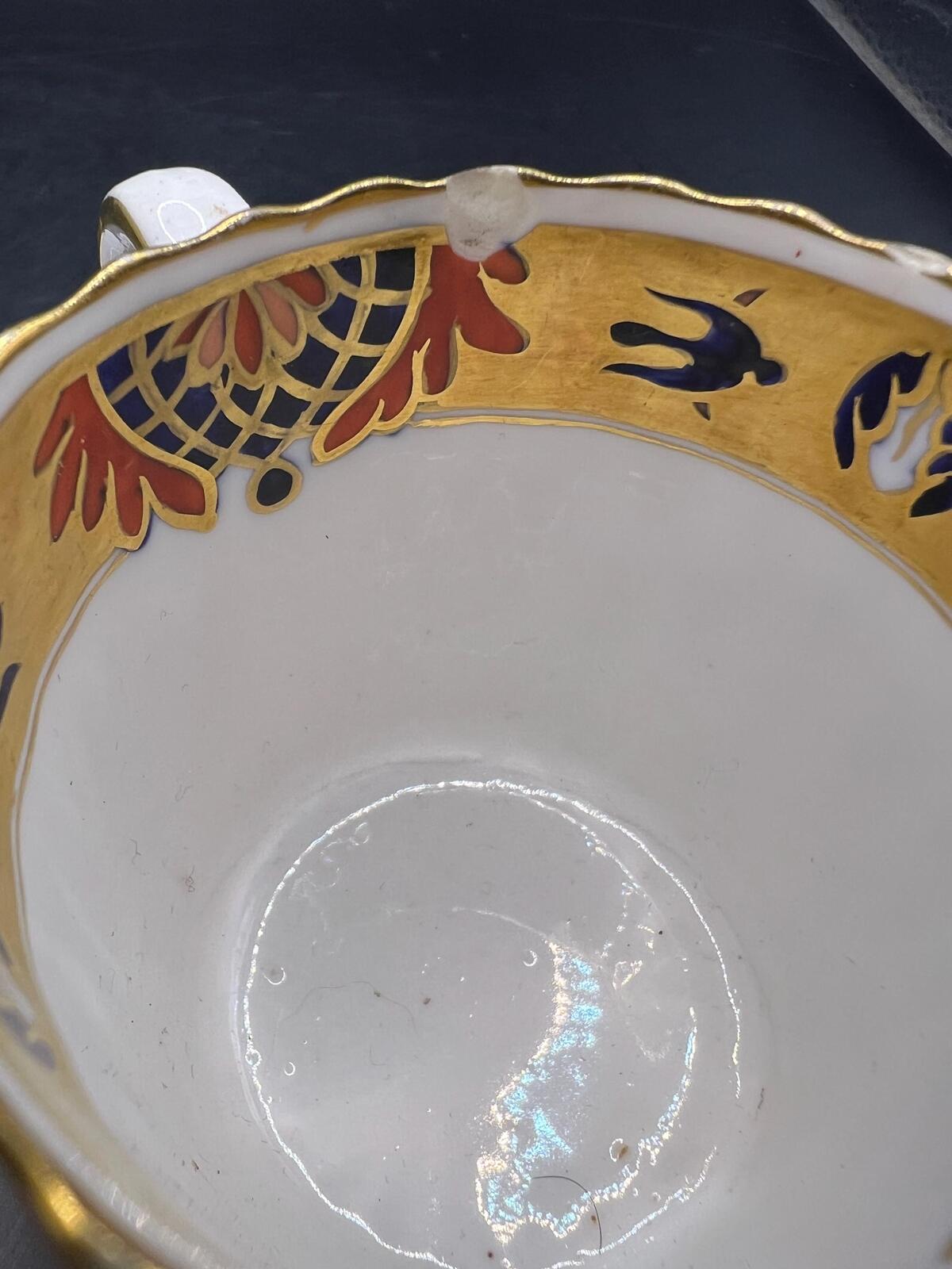 Antique coffee can / tea cup and saucer. Vibrant Imari pattern with gold gilt. Stamped Copeland 5.257. AS IS