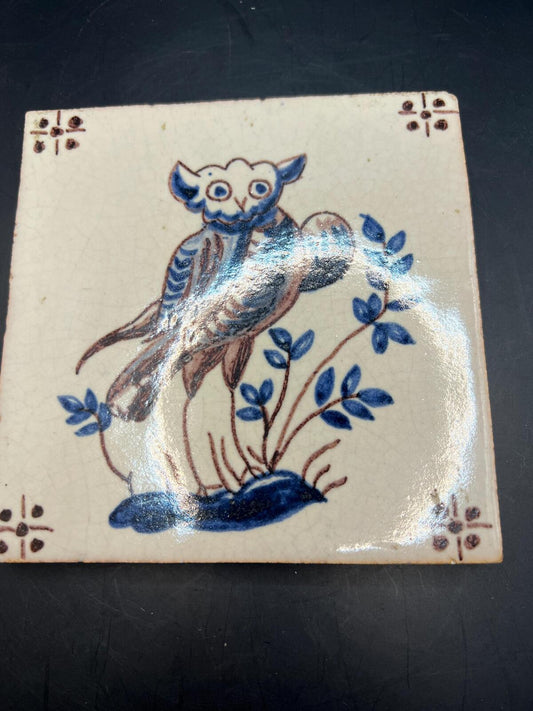 Antique Dutch Delft polychrome tile. Hand-painted owl with foliage.