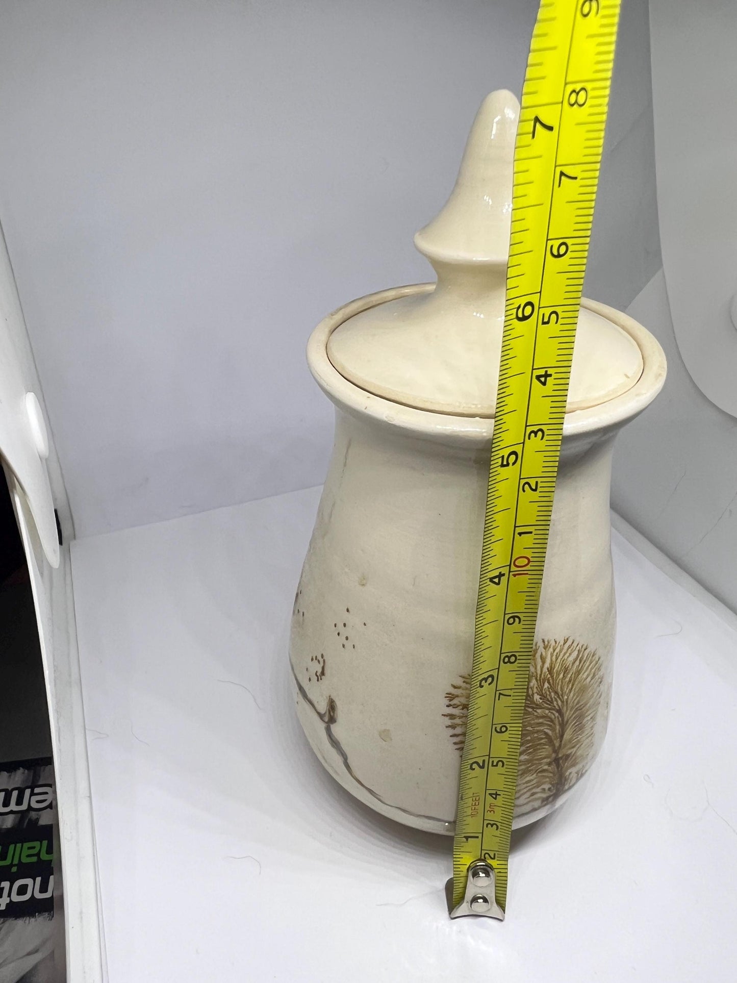 Studio pottery Mochaware lidded pot Cream glaze with tree design.