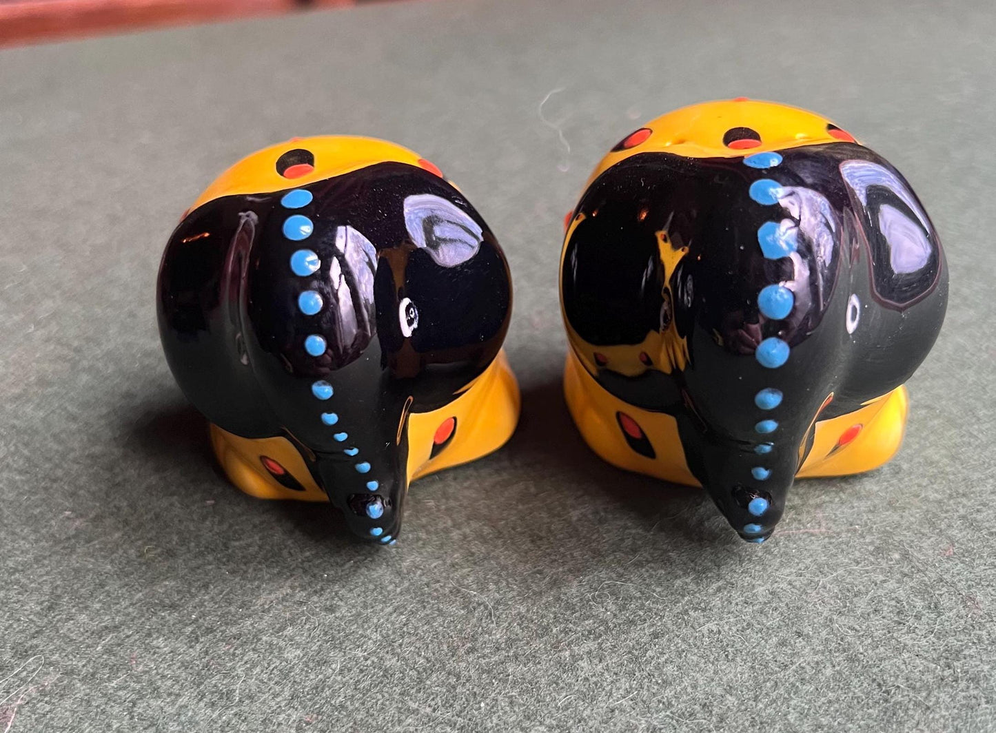 Quirky elephant salt and pepper shakers. Signed to base SUNA SA.