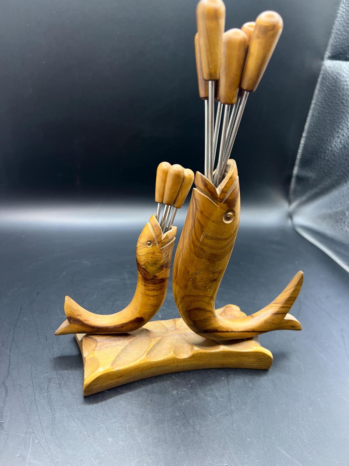 Wooden olive serving set. MCM carved olive wood fish design with 6 forks and 4 picks.