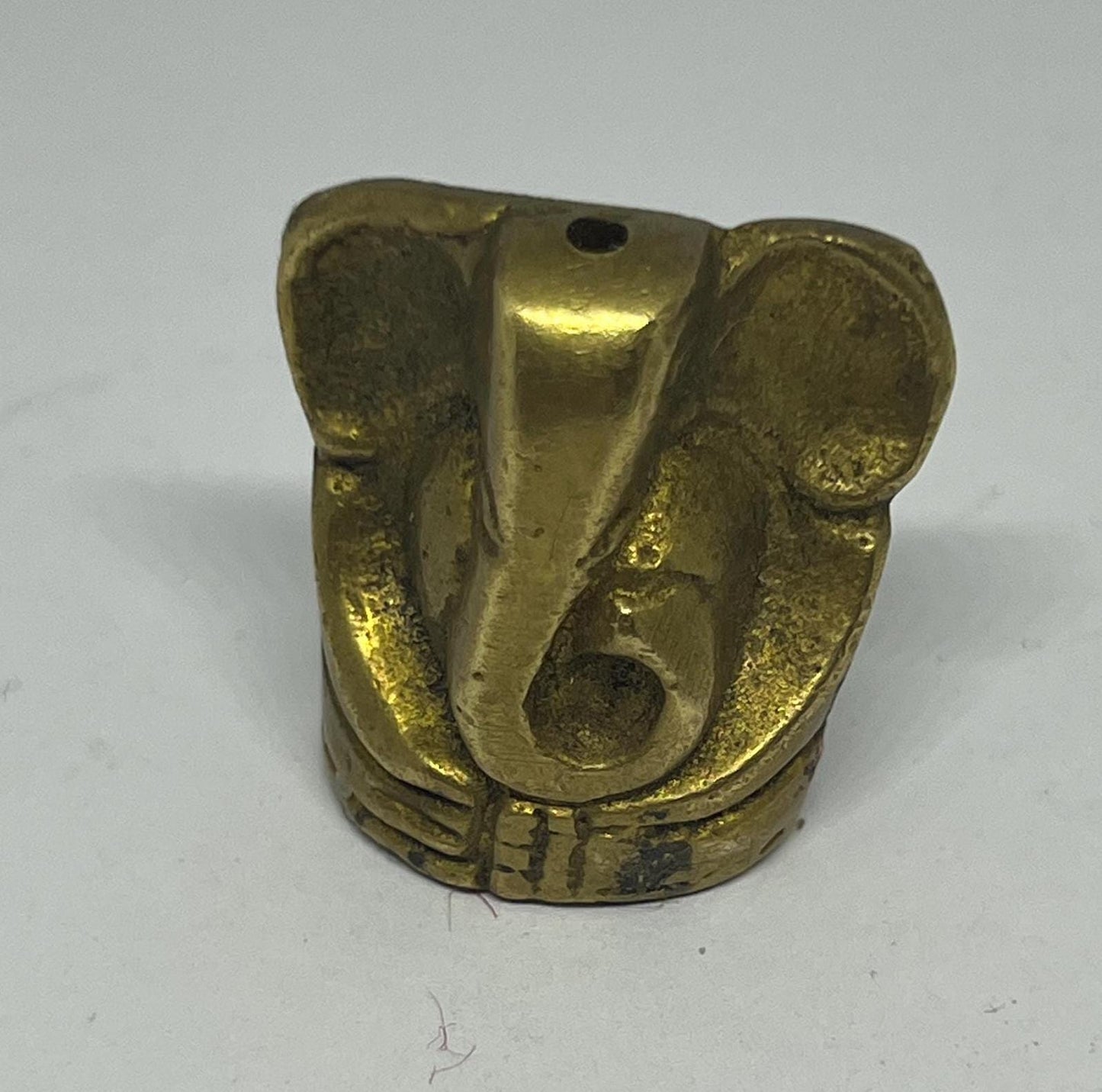 Tiny solid brass Ganesh elephant incense stick holder.