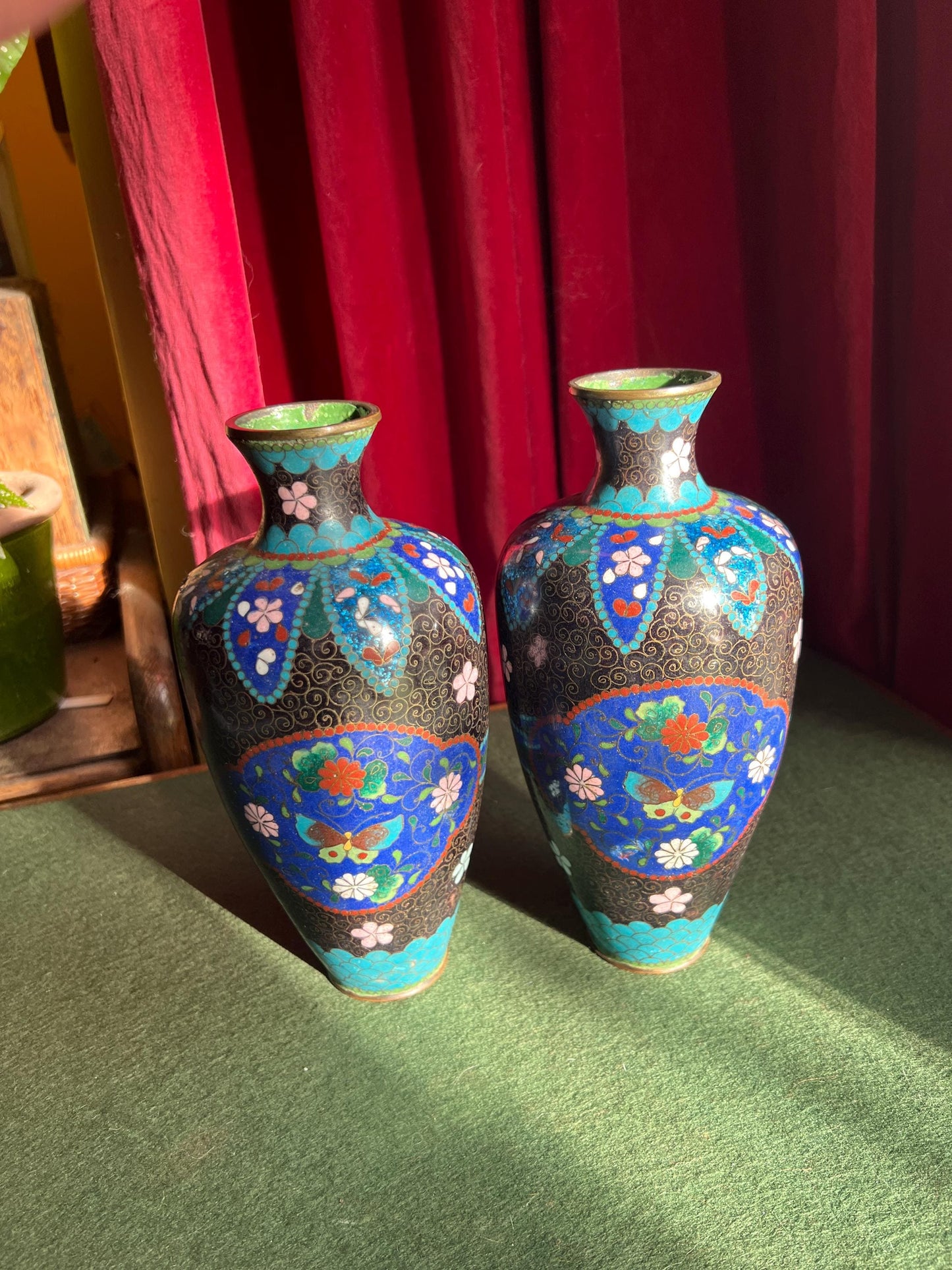 Pair of vintage antique cloisonne vases. Matching pair with intricate flowers and butterflies.