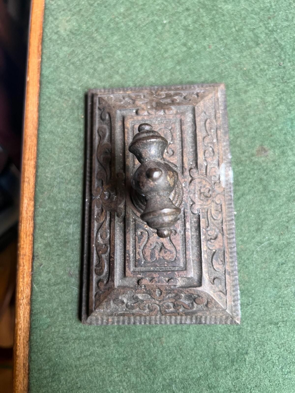 Ornate antique cast iron paperweight. Handled Victorian paperweight doorstop. Decorative pyramid swirl patterned quirky paperweight.