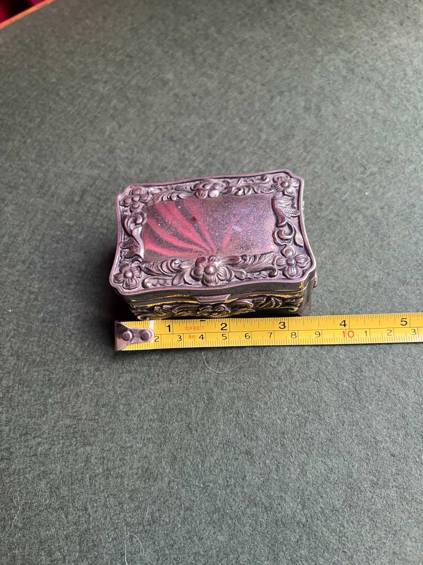 Vintage silver tone jewellery box. Embossed floral design treasure box blue lining.