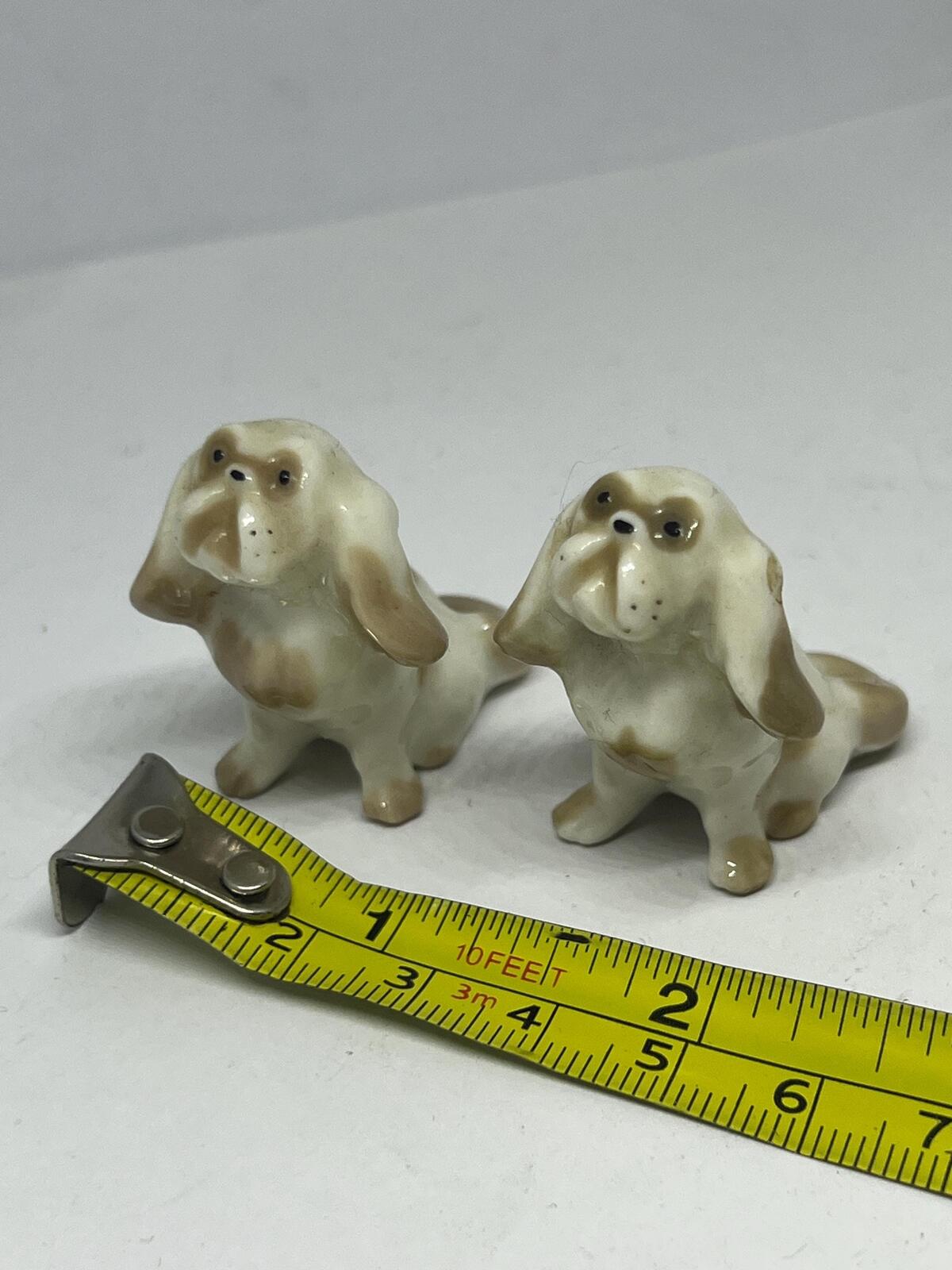 Pair of miniature Pekinese or Bolognese dogs. Hand painted Porcelain Lomonosov USSR dog figurines.