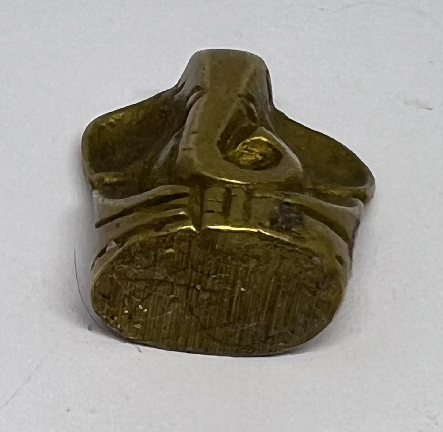 Tiny solid brass Ganesh elephant incense stick holder.