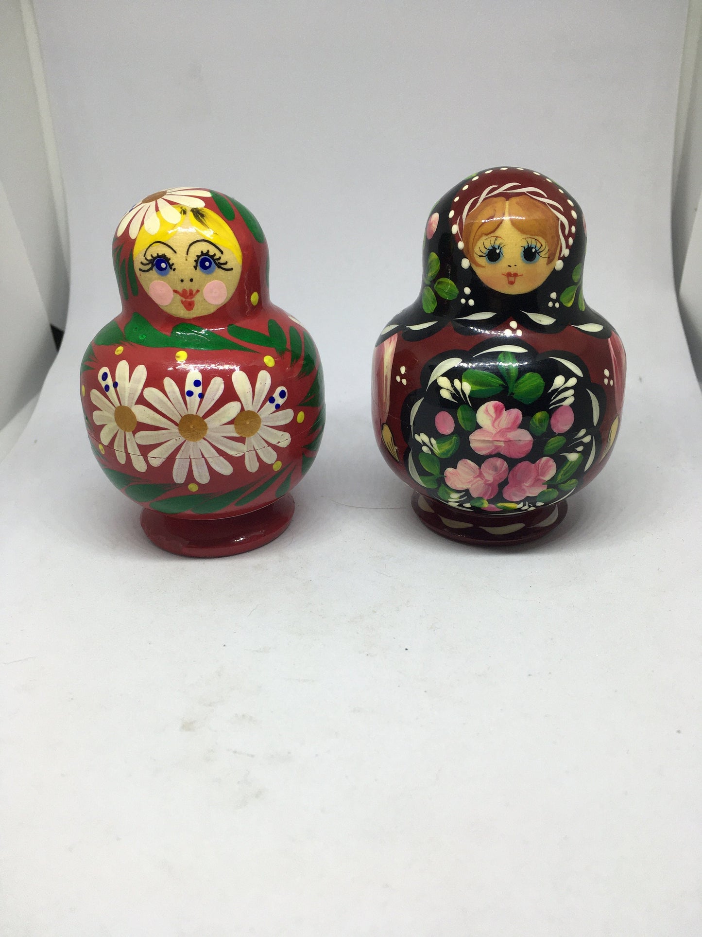 Matryoshka nesting dolls with 4 smaller dolls. Beautifully detailed floral designs. 1 available.