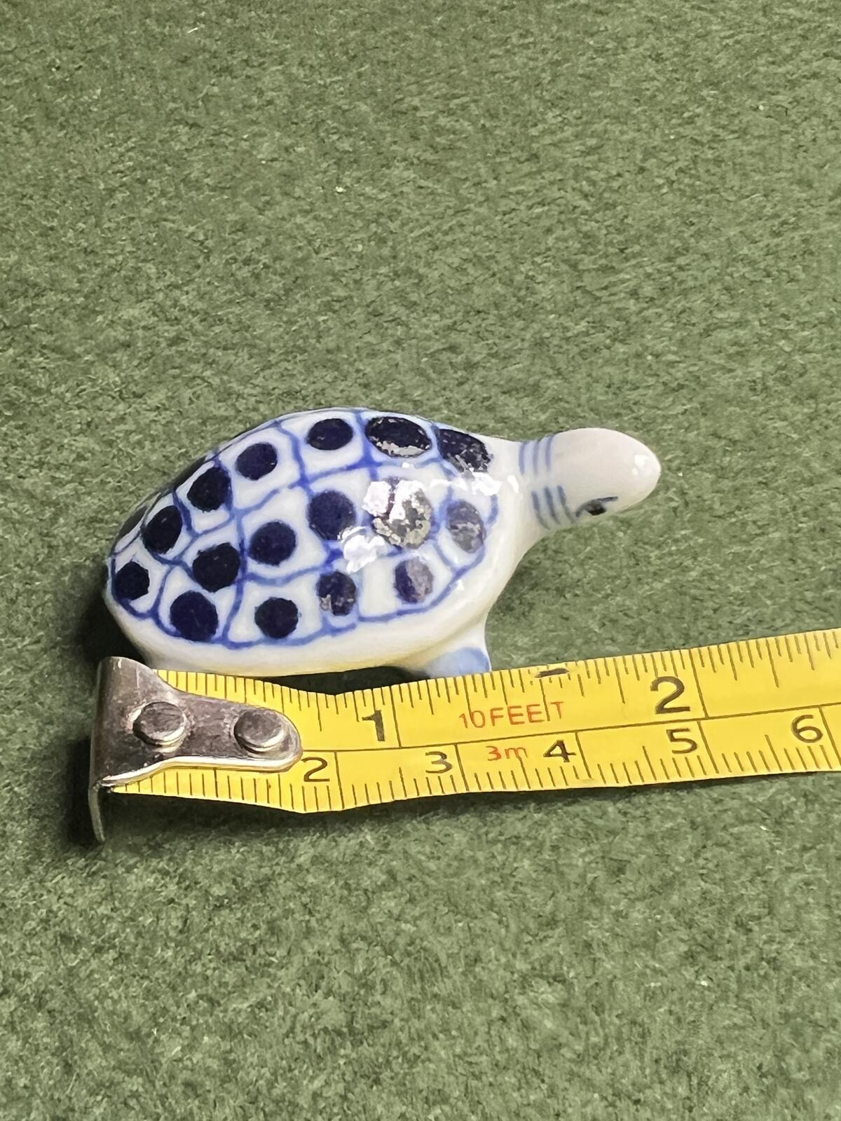 Vintage miniature tortoise figurine. Blue white ceramic hand painted turtle ornament.