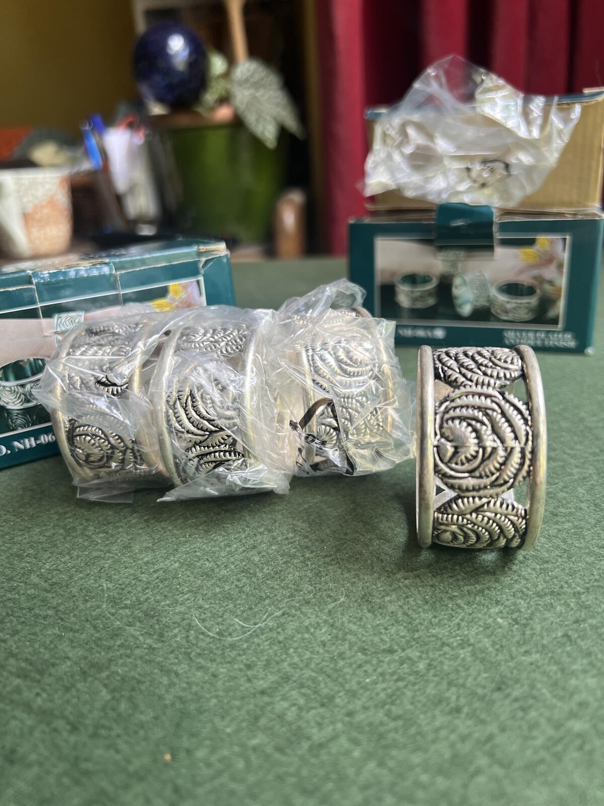 Vintage silver plate napkin rings. Rose theme design. 2 original boxes 8 in total.