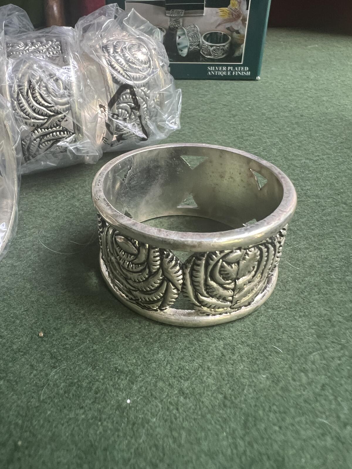 Vintage silver plate napkin rings. Rose theme design. 2 original boxes 8 in total.
