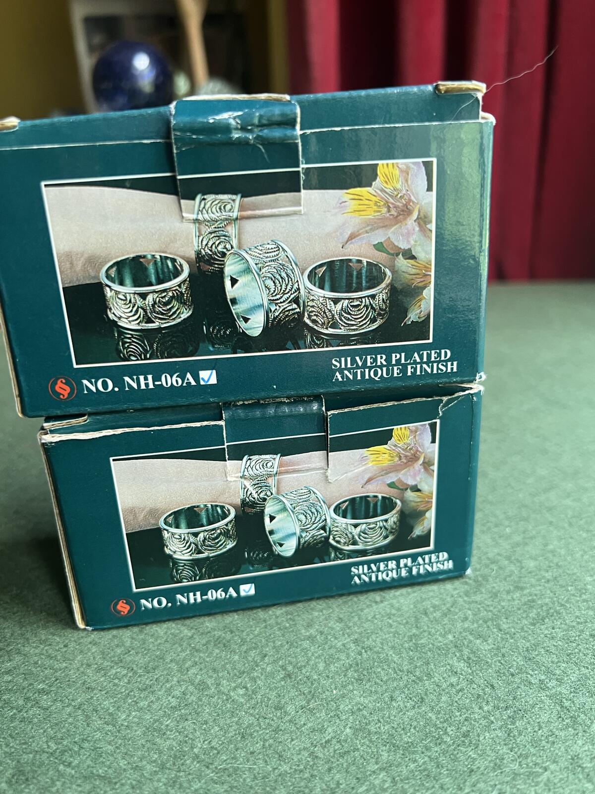 Vintage silver plate napkin rings. Rose theme design. 2 original boxes 8 in total.