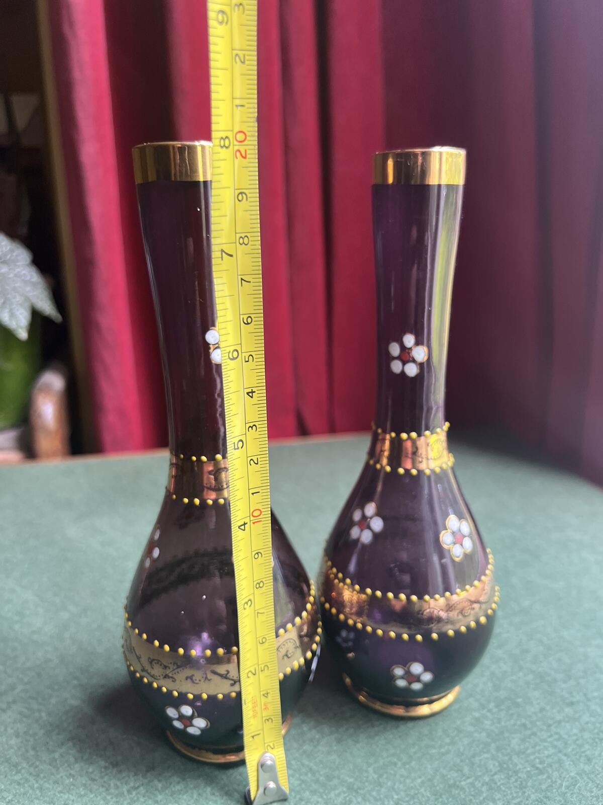 Pair of Bohemian amethyst glass bud vases. Gold enamelled floral decoration.