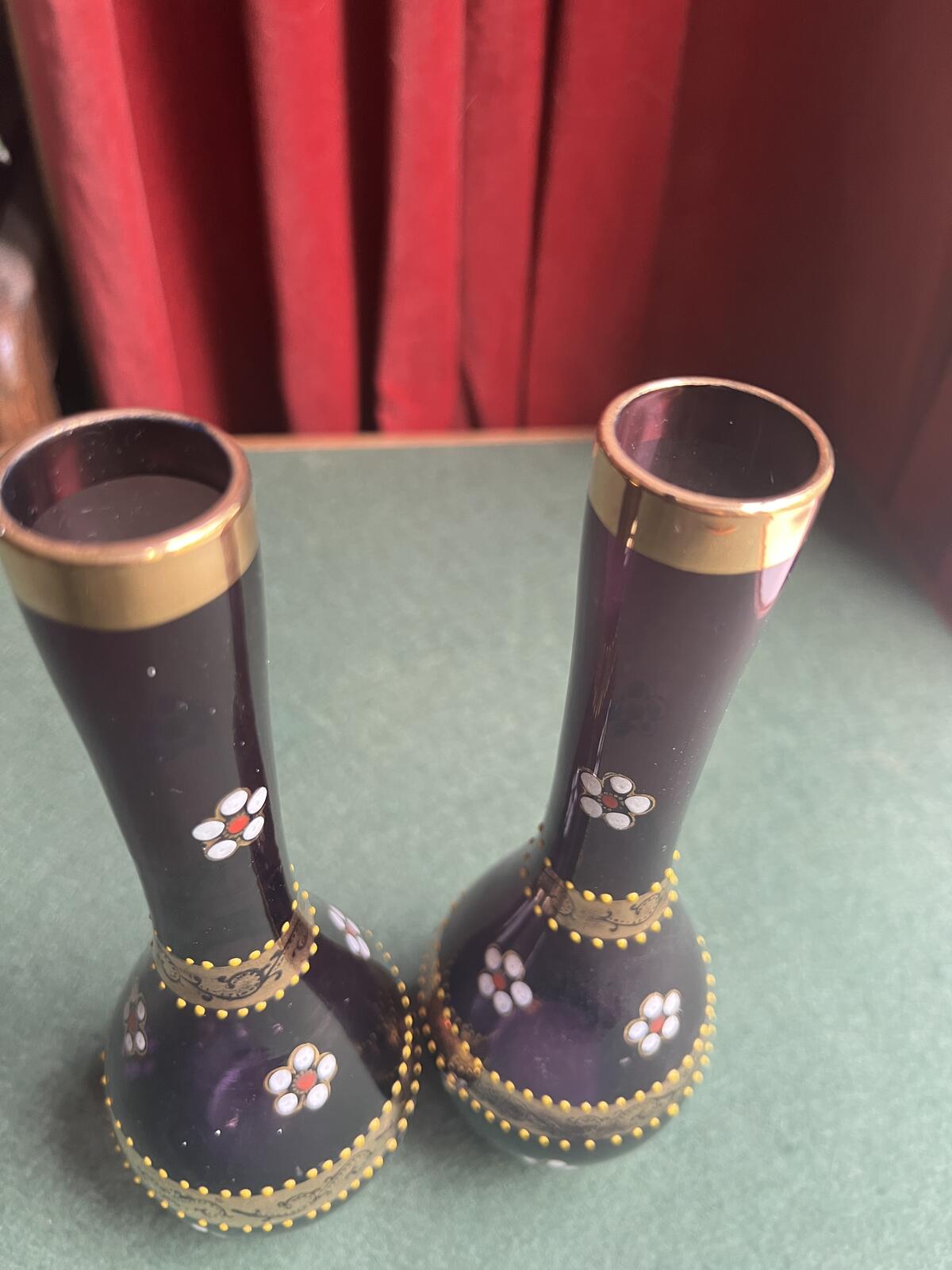 Pair of Bohemian amethyst glass bud vases. Gold enamelled floral decoration.