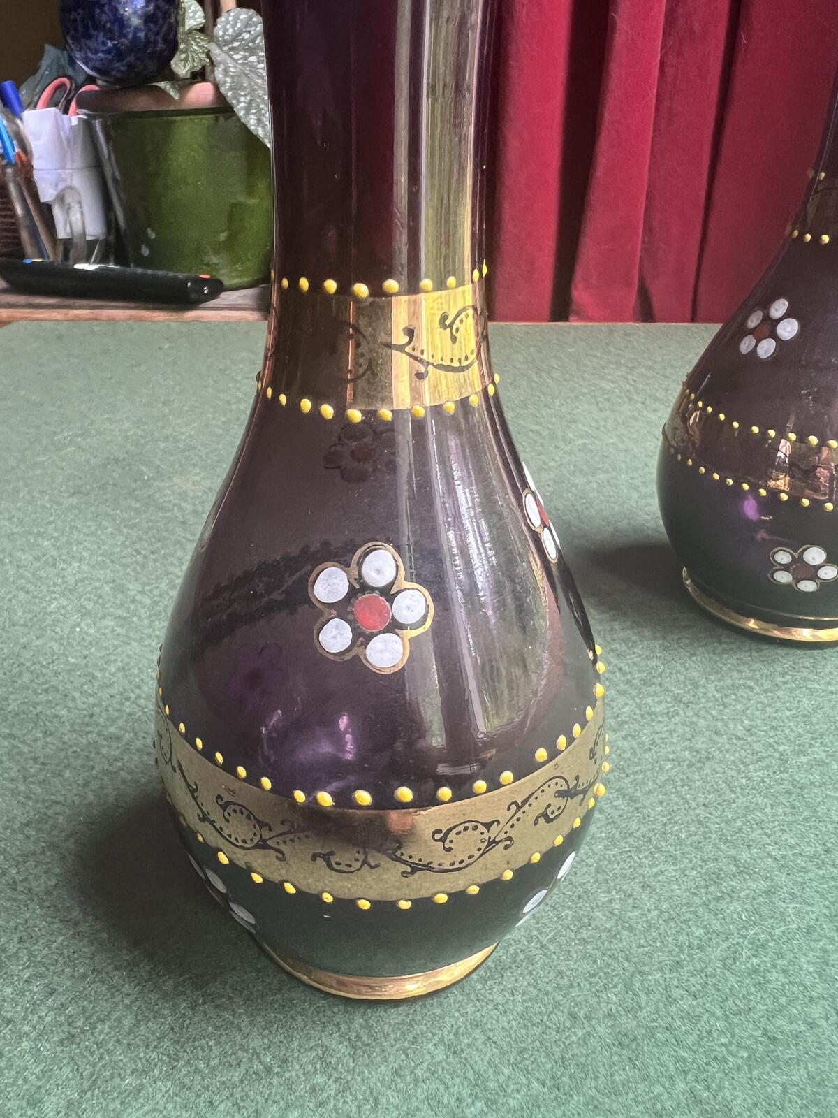 Pair of Bohemian amethyst glass bud vases. Gold enamelled floral decoration.