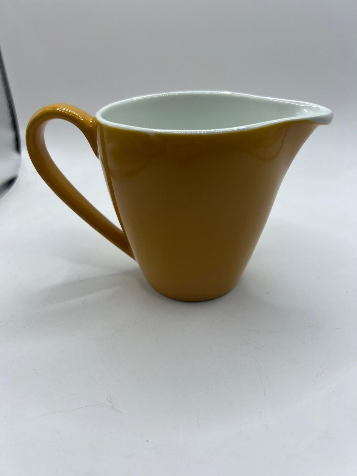Vintage mustard yellow milk jug creamer. Stamped Johnson Bros England.