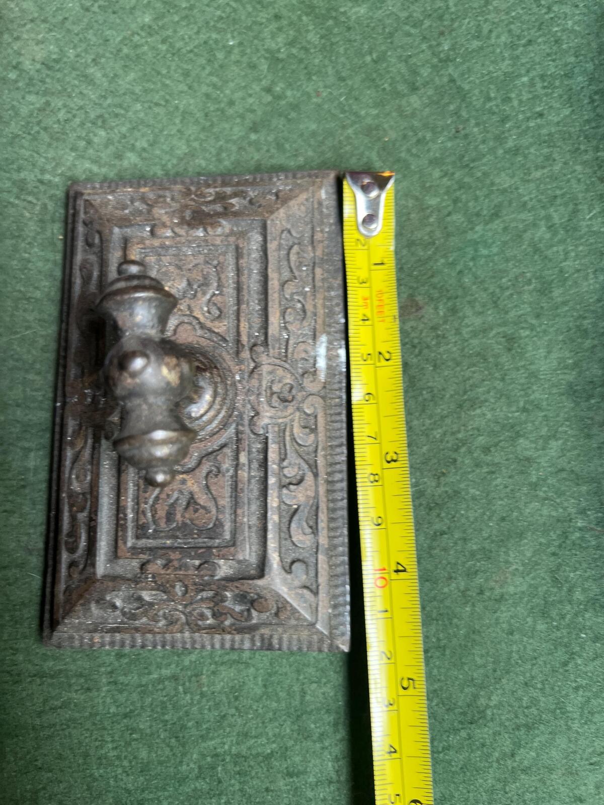 Ornate antique cast iron paperweight. Handled Victorian paperweight doorstop. Decorative pyramid swirl patterned quirky paperweight.