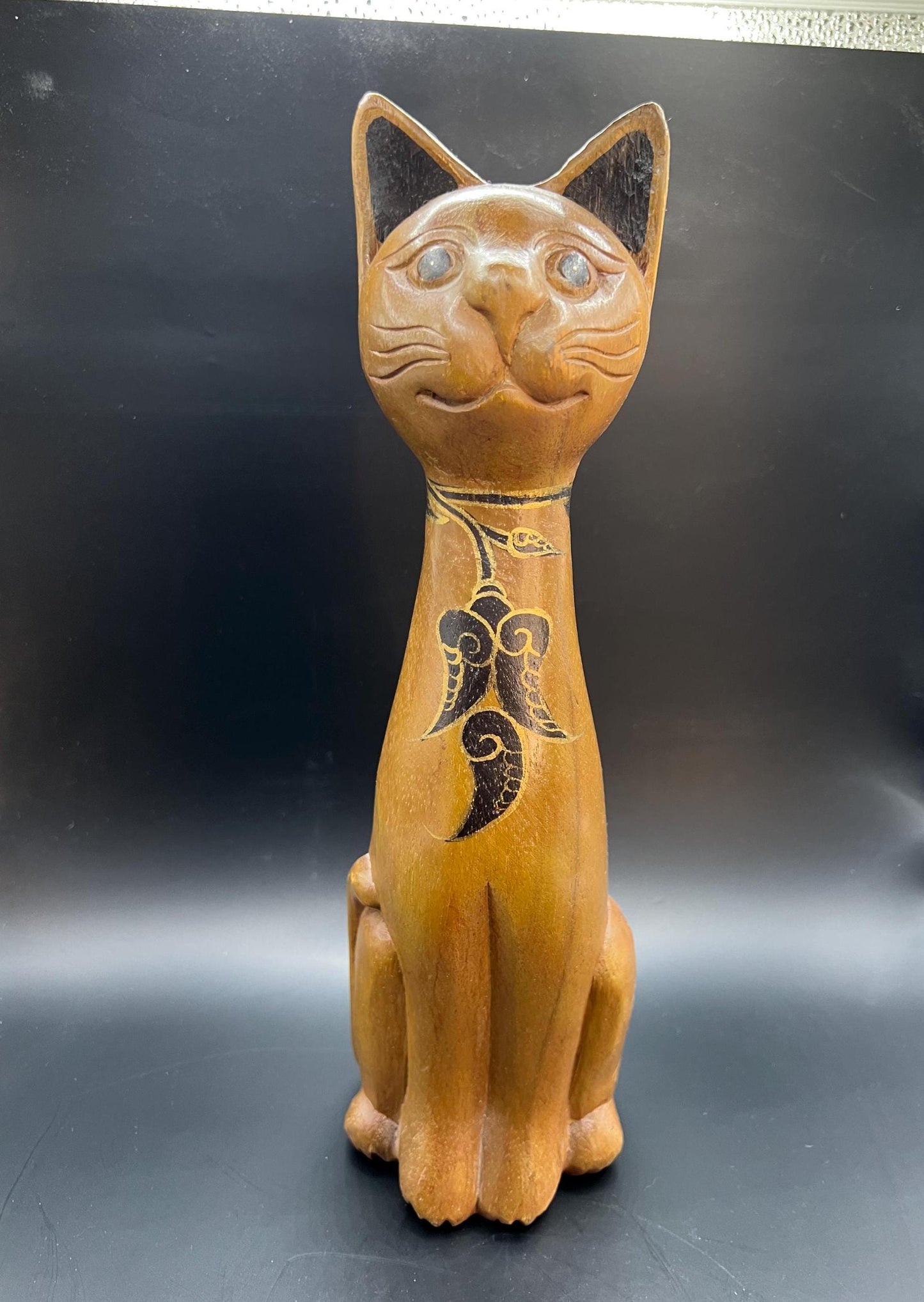 Hand carved wooden cat figurine. Made in Thailand.
