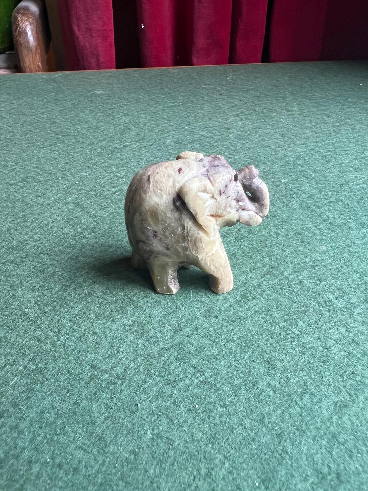 Stone elephant figure. Miniature marble hand carved lucky elephant.