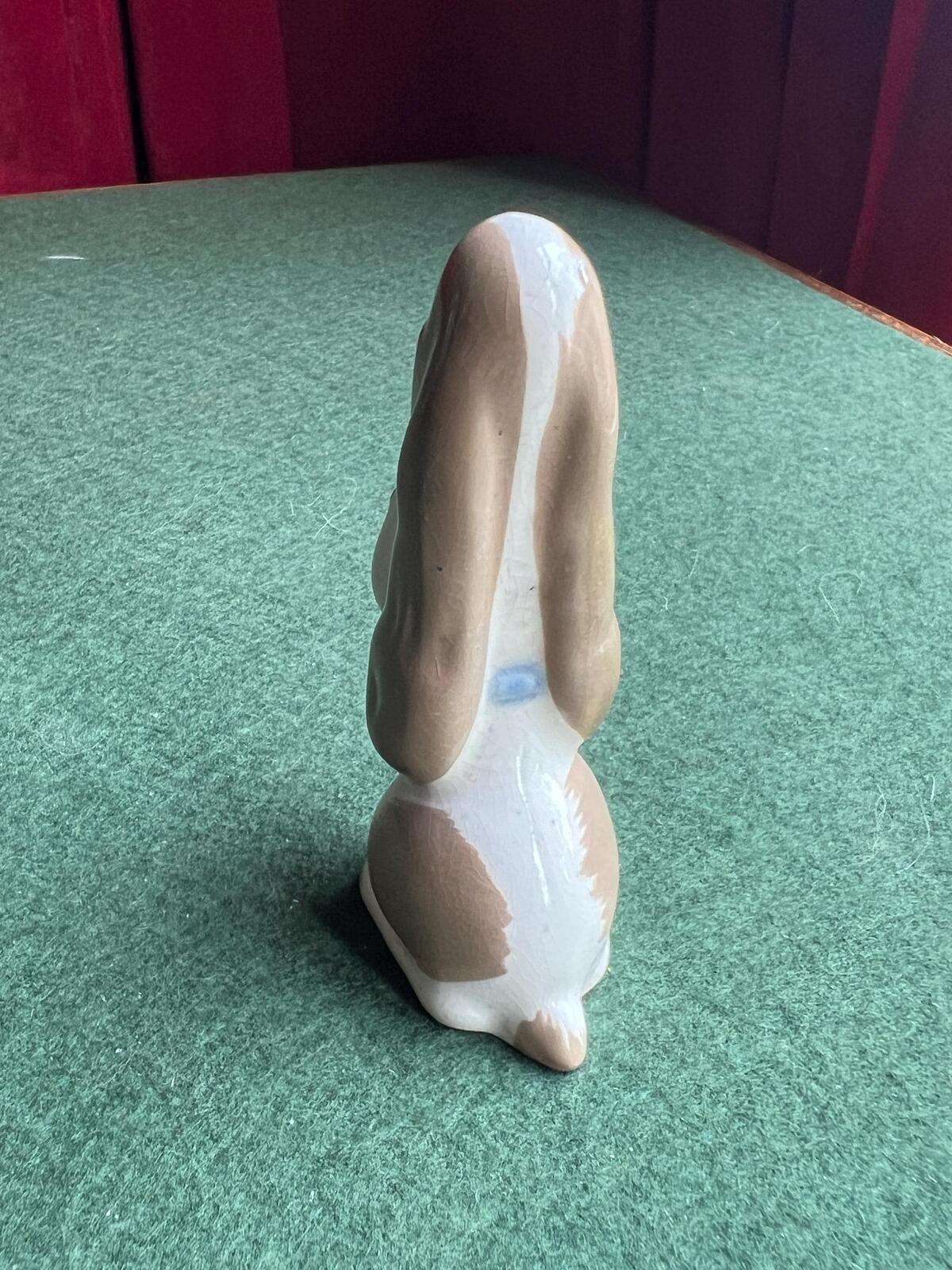Vintage ceramic sad hound dog figurine. Stamped Szeiler