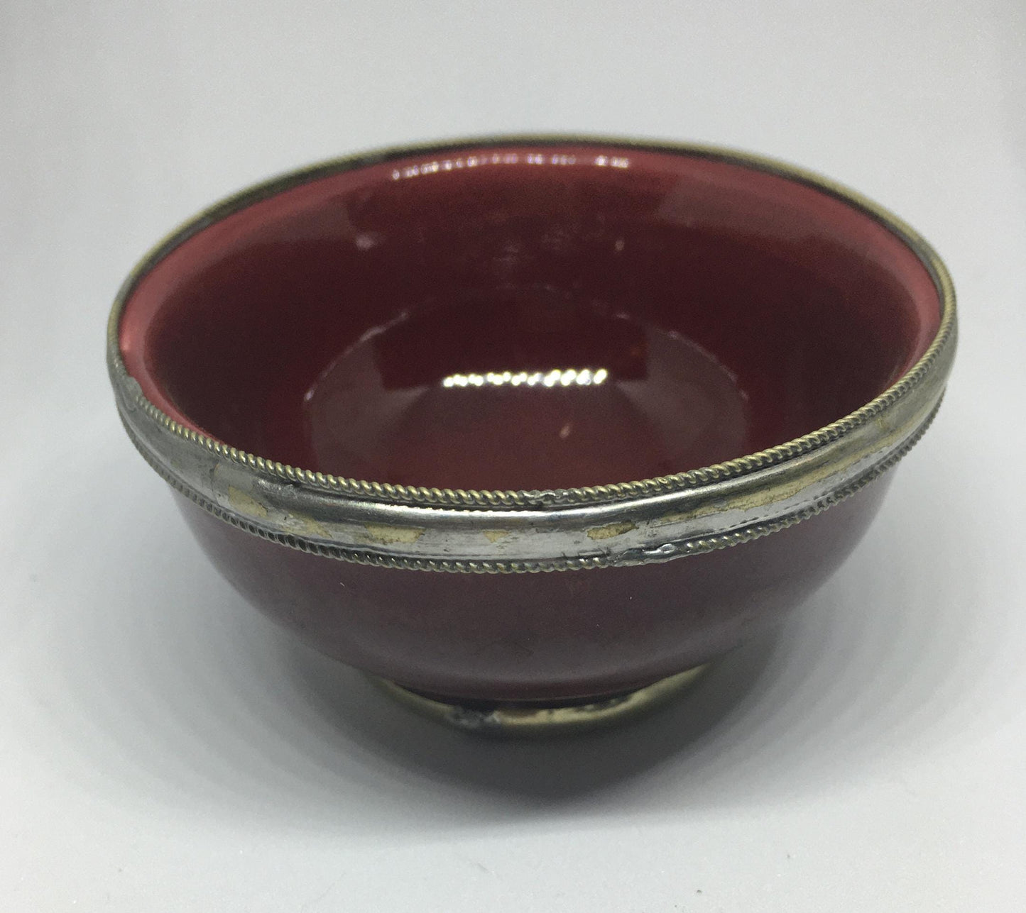 Vintage red glazed trinket pin dish with silver tone band.