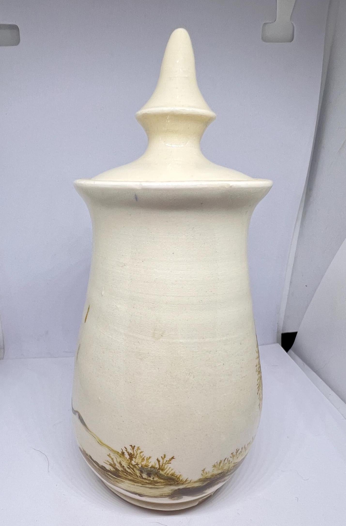 Studio pottery Mochaware lidded pot Cream glaze with tree design.