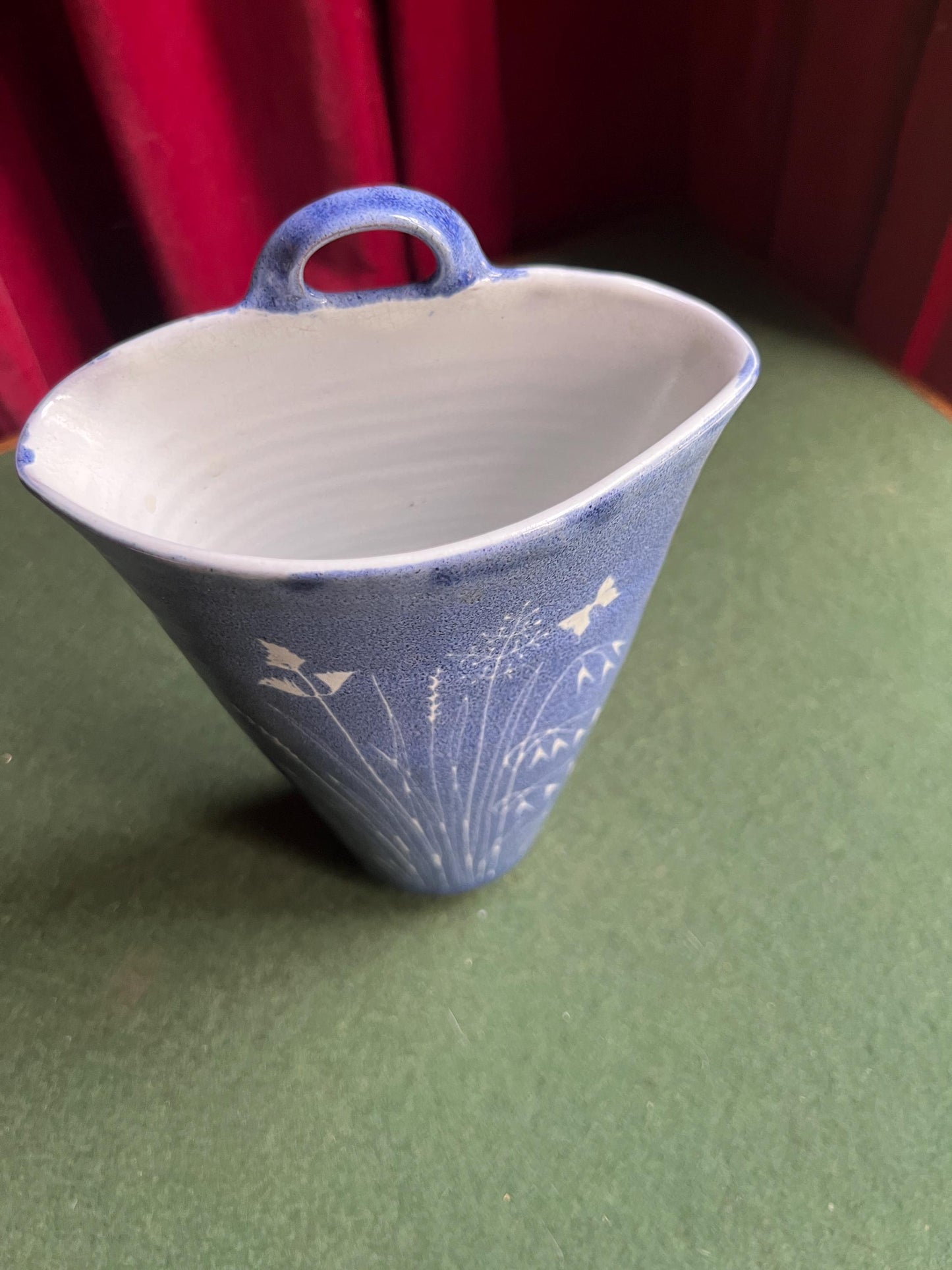 Studio pottery wall pocket. Blue glaze posy vase floral butterfly decor.