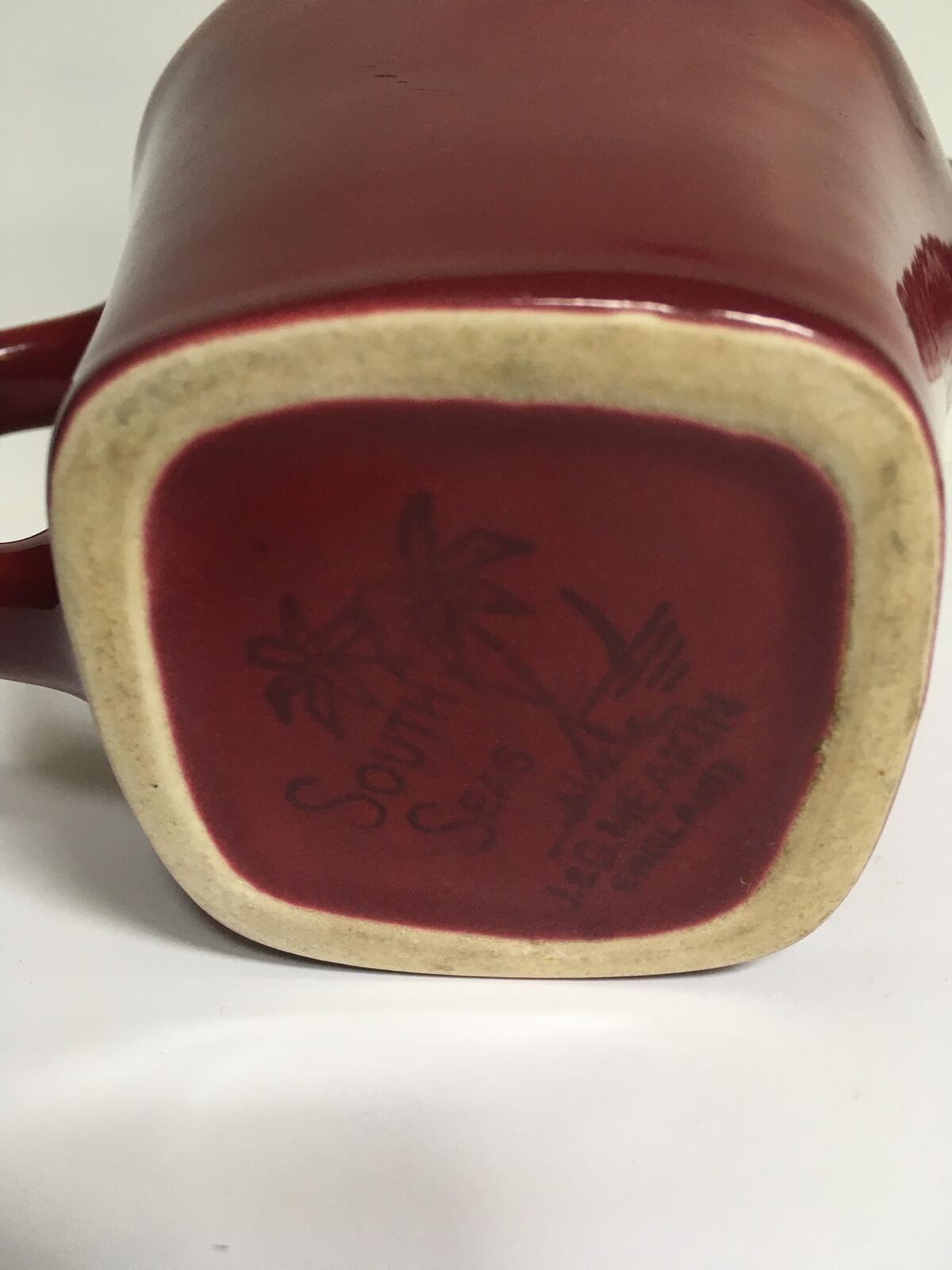 Deep red glazed gravy custard serving jug. Stamped South Seas JG Meakin.
