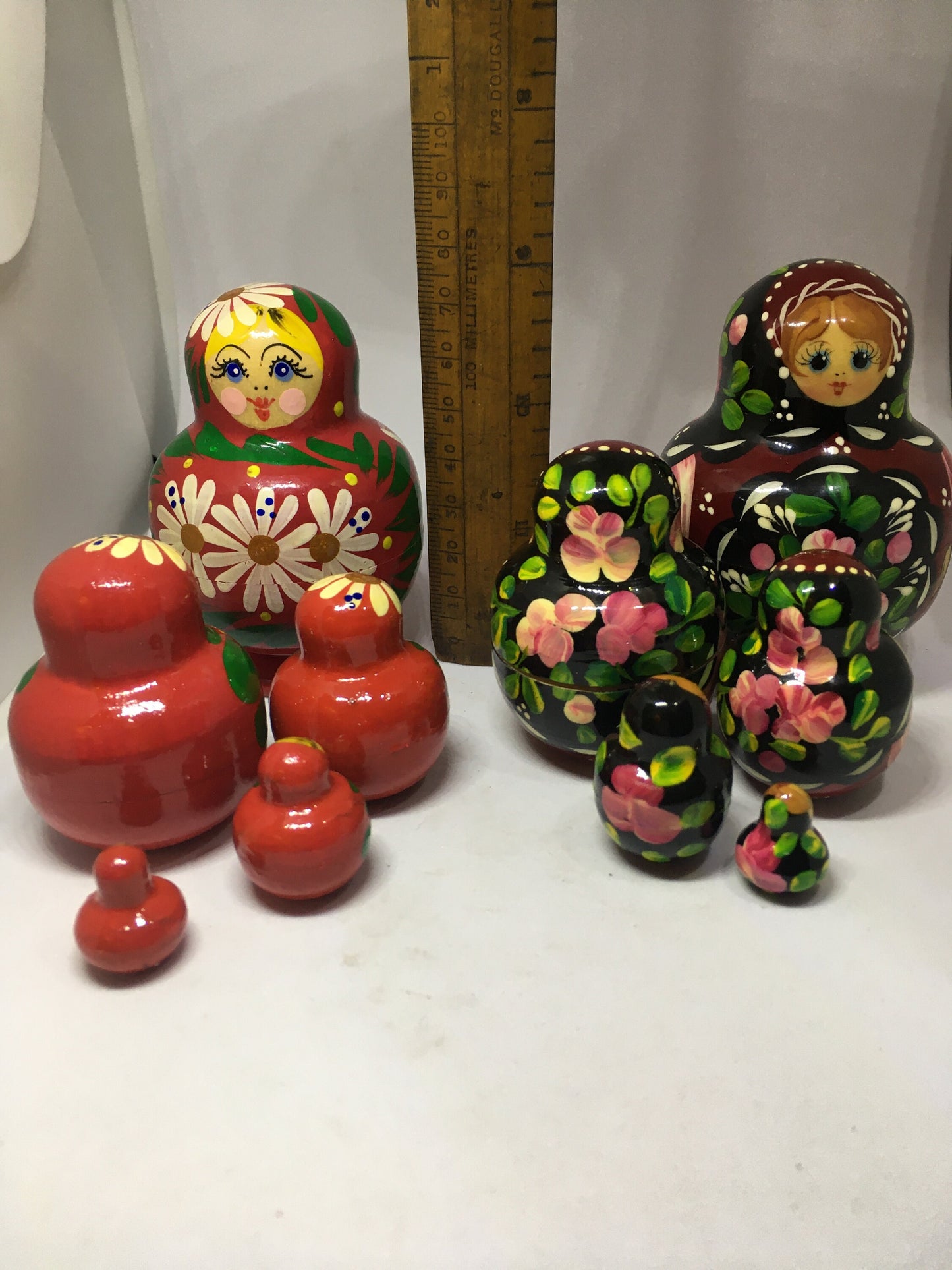 Matryoshka nesting dolls with 4 smaller dolls. Beautifully detailed floral designs. 1 available.